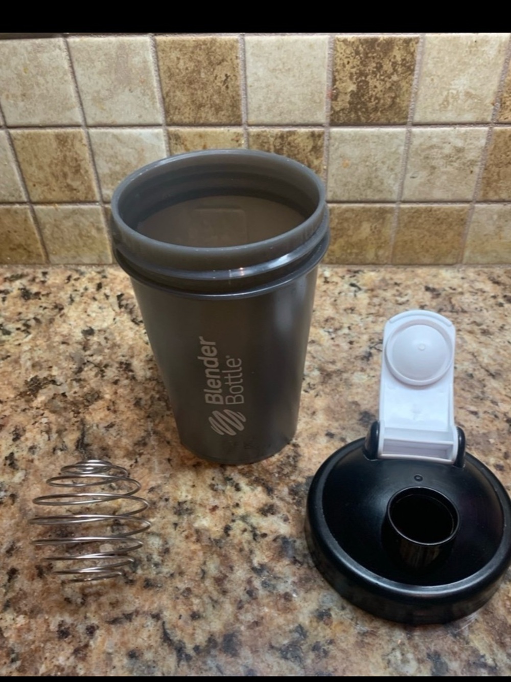Black BlenderBottle Classic V2 shaker bottle with a flip-top lid & carry loop.